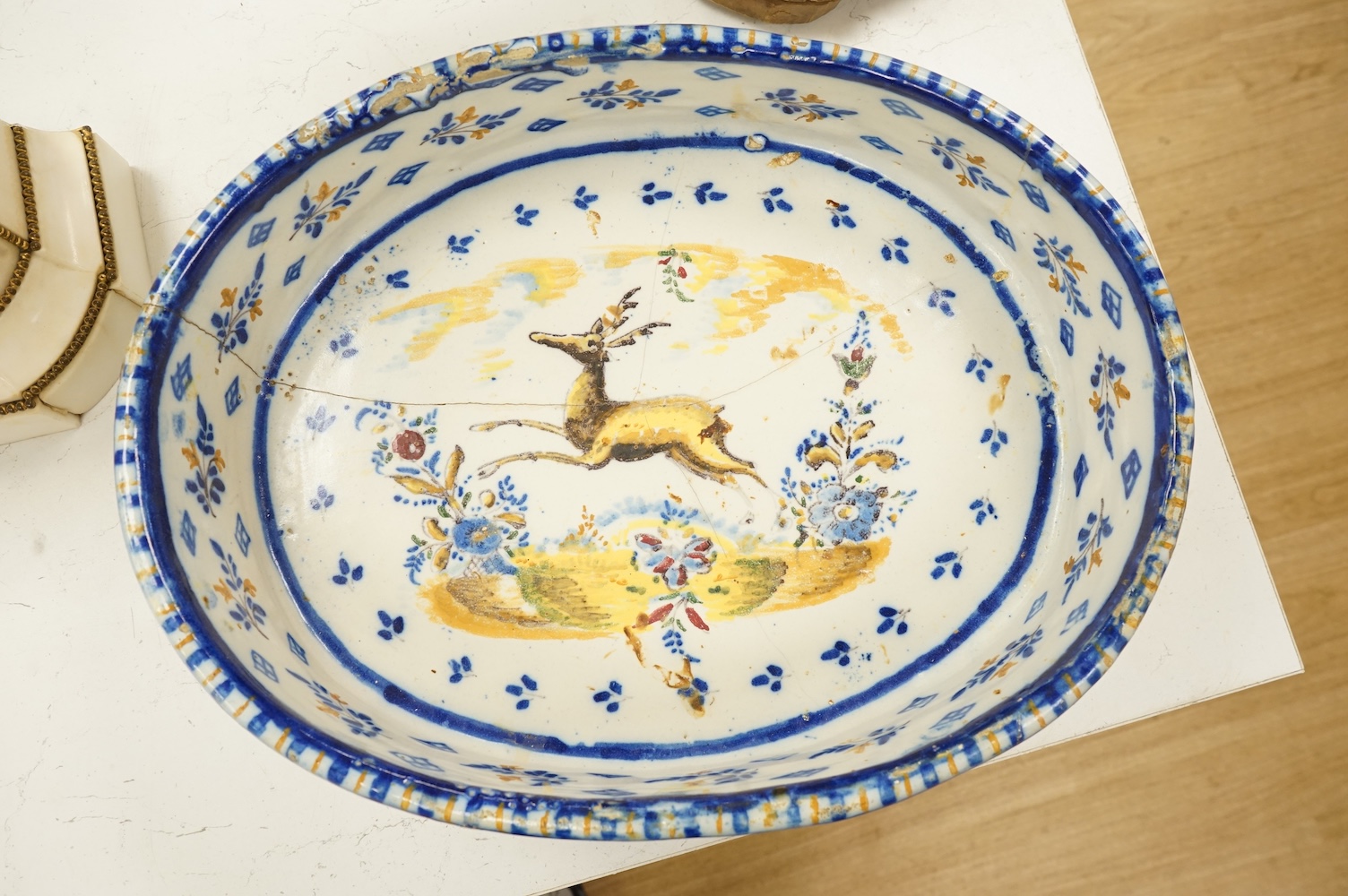An early 20th century French faience oval footed dish, 44cm
